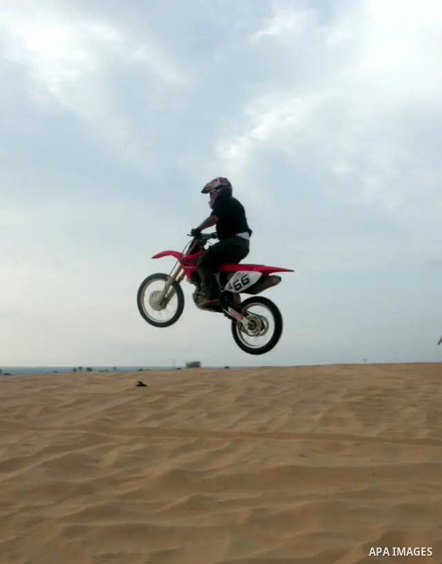 Palestinians ride their motorcycles as part of their weekend activities in the southern Gaza Strip city of Rafah on September 24, 2010. Hundreds of Palestinians spend their free time in the southern part of Gaza Strip ri...