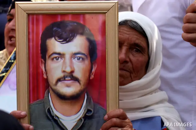 Palestinian women hold pictures of relatives held in an Israeli jail during a protest calling for the release of prisoners, in the West Bank city of Ramallah, Saturday Sept. 25, 2010. Photo by Eyad Jadallah