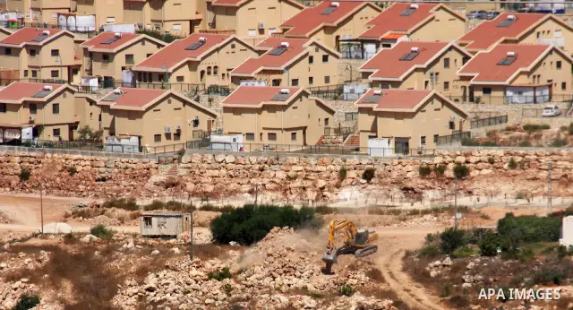 Israeli earth-moving equipment works in the Jewish settlement of Kiryat Netafim, near the West Bank village of Salfit, Monday on Sept. 27, 2010. Senior Palestinian official Yasser Abed Rabbo said Monday that President Ma...