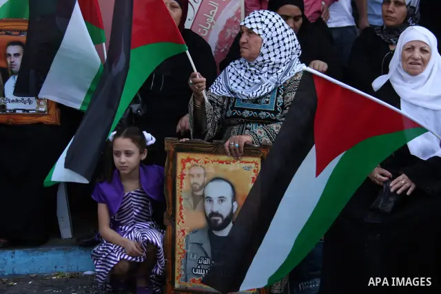 Palestinian women hold pictures of relatives, held in Israeli jails, during a protest calling for their release in the West Bank city of Nablus, Wednesday on Sept. 29, 2010 . Photo by Wagdi Eshtayah