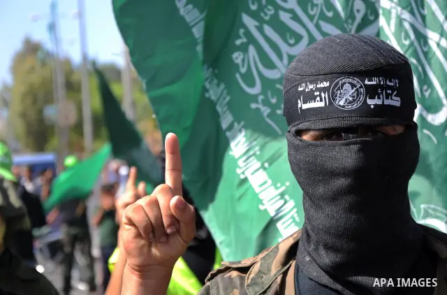 Hamas militants take part in a rally marking the 10th anniversary of Al-Aqsa Intifada 'uprising' and against peace talks with Israel in the Central Gaza Strip on October 1, 2010 . Photo by Wassim Fatair