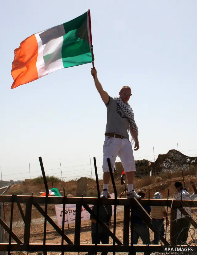 Palestinians and foreign activists take part in a protest against Israel's separation barrier in the West Bank village of Bilin near Ramallah, Friday, Oct. 1, 2010. U.S. Middle East envoy George Mitchell was shuttling be...