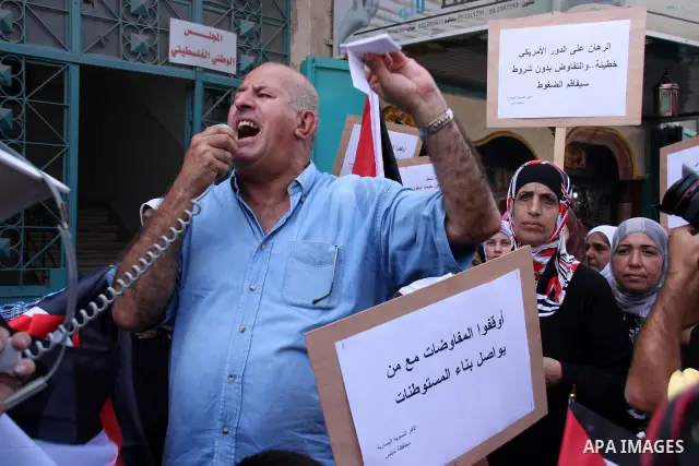 Palestinians protest against the peace talks between Israel and the Palestinian leadership in the northern Israeli occupied West Bank town of Nablus, on October 02, 2010. Israel's insistence on building settlements has b...