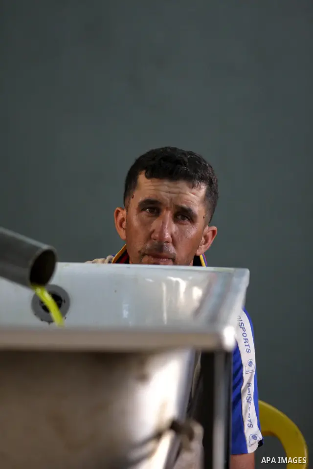 A Palestinian man squeezes olives at a traditional olives mill in Kharbathat Musbah village near the West Bank city of Ramallah October 3, 2010. Farmers across the Palestinian territories have started to harvest their ol...