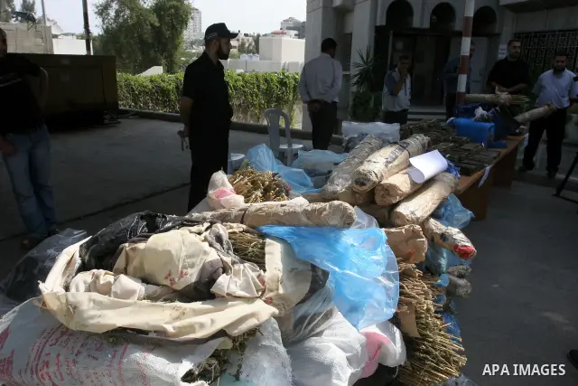 Palestinian Hamas police officers display large quantities of the seized drugs during a press conference , and they will burn this amount of drugs , in Gaza City on Oct 5,2010 . Photo by Mohammed Asad