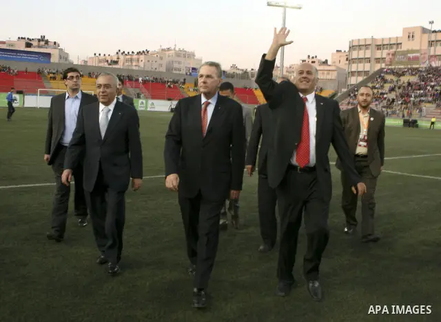 The President of the International Olympic Committee (IOC) Jacques Rogge, Palestinian prime minister Salam Fayyad and Palestinian Olympic Committee President Jibril Rajoub attend a friendly match between Palestine and Jo...