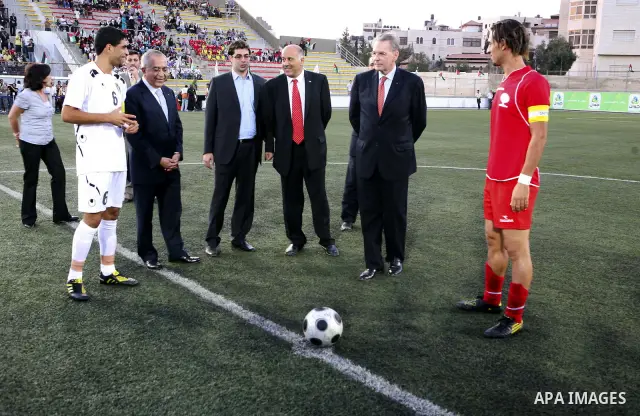 The President of the International Olympic Committee (IOC) Jacques Rogge, Palestinian prime minister Salam Fayyad and Palestinian Olympic Committee President Jibril Rajoub attend a friendly match between Palestine and Jo...