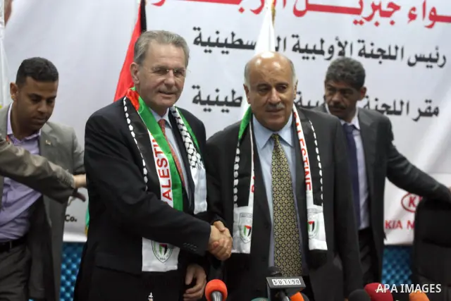 The president of the International Olympic Committee (IOC) Jacques Roggue and Palestinian Jebril Alrojob, head of Palestinian Olympic committee speak during a press conference in the West Bank City of Ramallah, 05 Octobe...