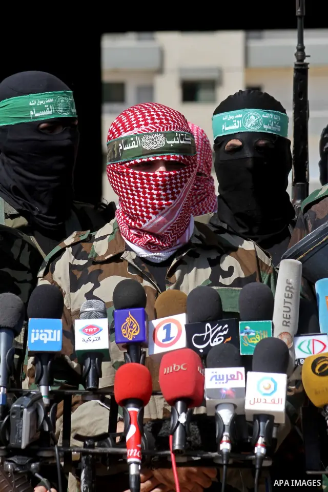 Masked Palestinian militants, some from Hamas, hold a press conference in Gaza City on October 6, 2010. About two dozen gunmen from various groups accused Palestinian President Mahmoud Abbas' security forces of arresting...