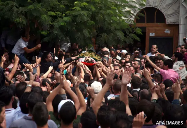 Palestinians carry the body of a Hamas militant Mamoun al-Natsha during his funeral in the West Bank city of Hebron, Friday, Oct. 8, 2010. Israeli troops killed two senior Hamas militants in an early-morning raid in the...