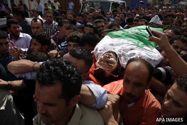 Palestinians carry the body of a Hamas militant Mamoun al-Natsha during his funeral in the West Bank city of Hebron, Friday, Oct. 8, 2010. Israeli troops killed two senior Hamas militants in an early-morning raid in the...