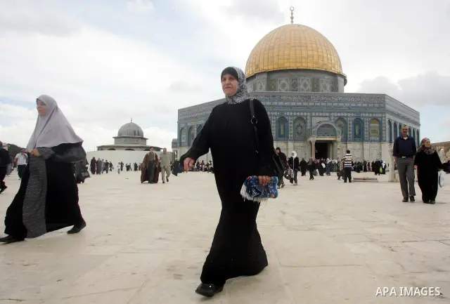 Palestinian Muslims walk in front of the Dome of Rock after Friday prayers in the Al Aqsa Mosque compound, also known to Jews as the Temple Mount, in Jerusalem's old city on Oct. 8, 2010. Photo by Mahfouz Abu Turk