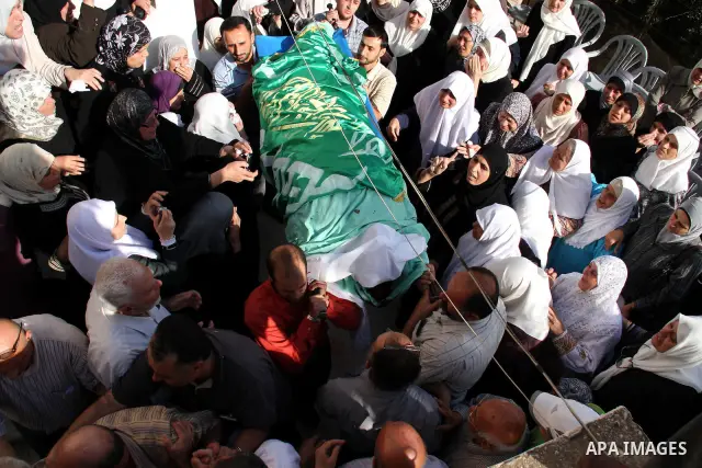 Palestinians carry the body of senior Hamas militant Nashat al-Karmi during his funeral, in the West Bank city of Tulkarem, Friday, Oct. 8, 2010. Israeli troops killed two senior Hamas militants in an early-morning raid...