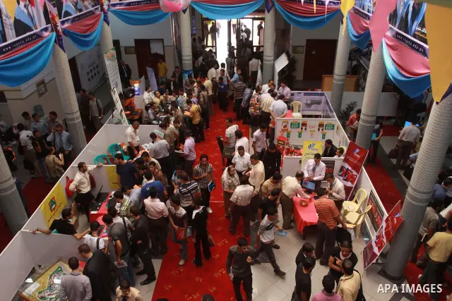 Palestinian students are seen during exhibition for engineering college in the Islamic University in Gaza City on October 10,2010 . Photo by Mohammed Asad