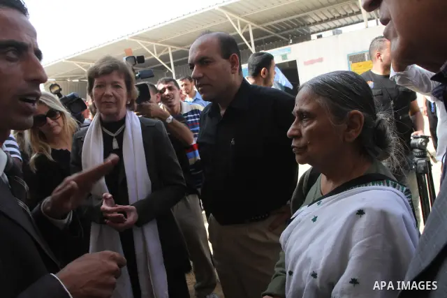 Delegates of The Elders group of retired prominent world figures, former Irish president Mary Robinson , Indian activist Ela Bhatt and former UN envoy Lakhdar Brahimi , visit a UN-run school in Nussirat refugee camp in t...