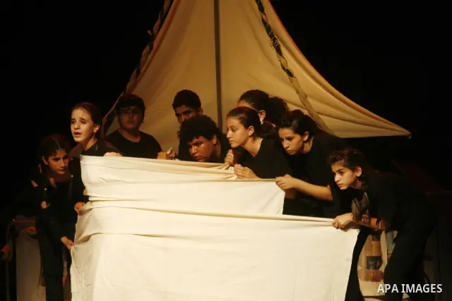 Palestinian children are performing the play "Gaza mono-logues" in the Cultural Palace,in the West Bank city of Ramallah on Oct. 17, 2010 . Photo by Issam Rimawi