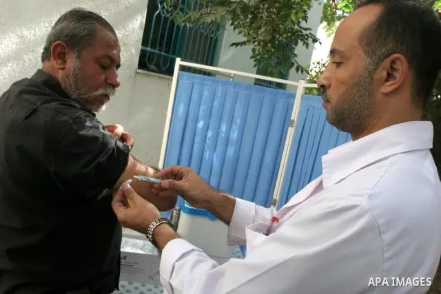 A Palestinian medical workers inject vaccination for pilgrims who want to perform the annual pilgrimage to the Muslim holy city of Mecca, in Gaza City , on Oct 19, 2010. Hundreds of Palestinian pilgrims crossed into Egyp...
