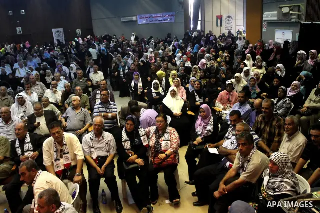 Palestinians attend a rally at Rashad al-Shawa center , in Gaza City on Oct. 19, 2010 marking the 42nd anniversary of the Palestinian Arab Front founding . And also to support the national unity and against the division...
