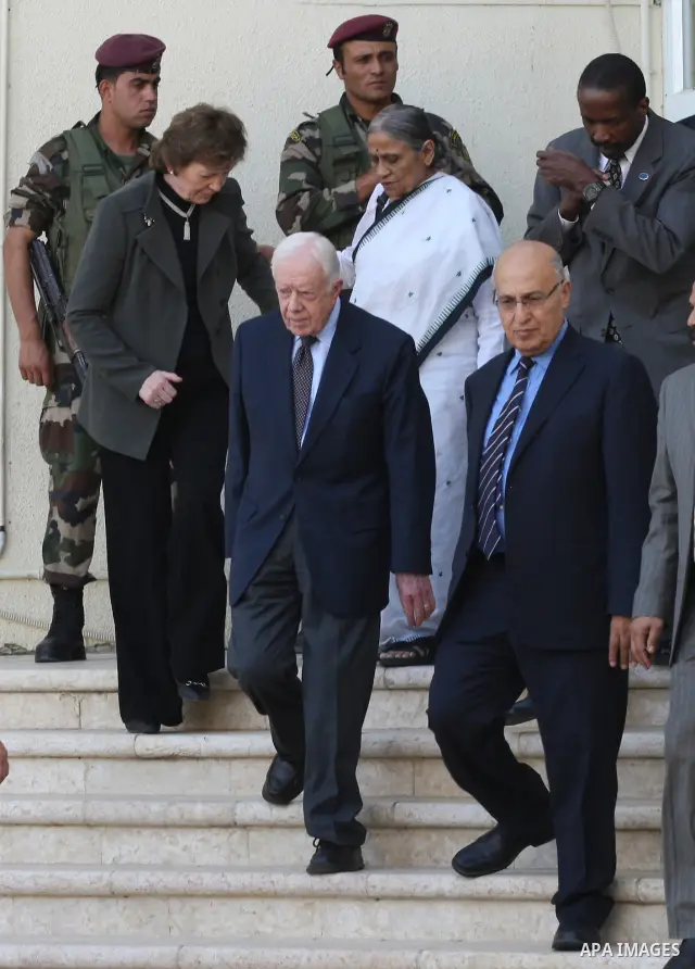 Former Irish president Mary Robinson,former US president Jimmy Carter ,and Ela Bhatt ,leader of international labour, cooperative, women, and micro-finance movements, all'elders' members, talk to media after their meetin...
