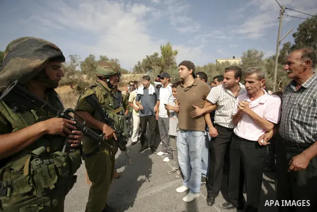 Palestinians scuffle with Israeli border policemen during clashes in the West Bank village of Nabi Saleh, on 22 October 2010. Palestinians protest weekly against the neighbouring Jewish settlement of Halamish. Photo by E...