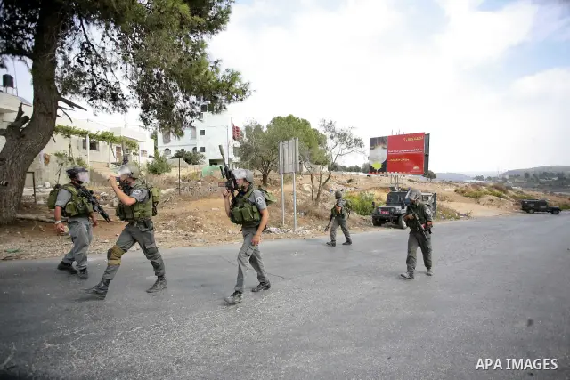 Israeli border policemen take part during clashes in the West Bank village of Nabi Saleh, on 22 October 2010. Palestinians protest weekly against the neighbouring Jewish settlement of Halamish. Photo by Eyad Jadallah