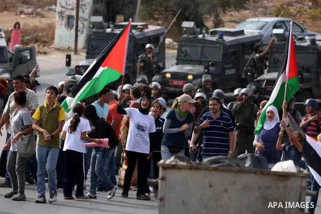 Palestinians scuffle with Israeli border policemen during clashes in the West Bank village of Nabi Saleh, on 22 October 2010. Palestinians protest weekly against the neighbouring Jewish settlement of Halamish. Photo by I...