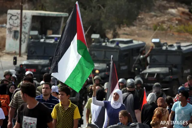 Palestinians scuffle with Israeli border policemen during clashes in the West Bank village of Nabi Saleh, on 22 October 2010. Palestinians protest weekly against the neighbouring Jewish settlement of Halamish. Photo by I...