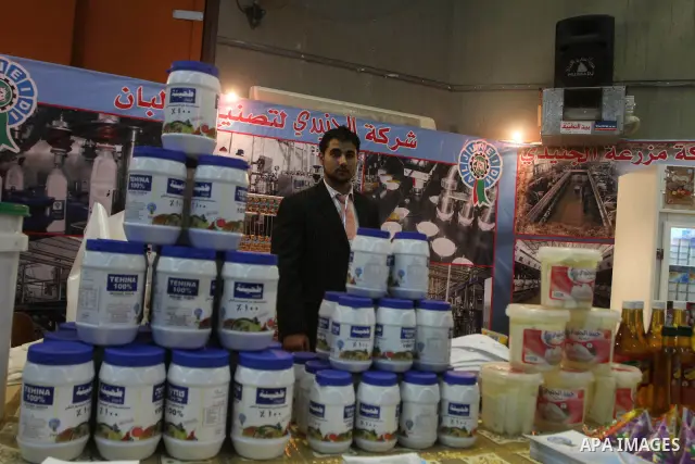 Palestinians attend exhibition for Palestinian food , in Gaza City on Oct.25,2010 . to support the Palestinian national products . Photo by Ashraf Amra