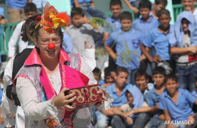Palestinian schoolchildren watch a performance presented by the British circus at a school in Biet Lahia in the northern of Gaza Strip on Oct. 25, 2010. The British circus recently arrived to the Gaza Strip to present a...