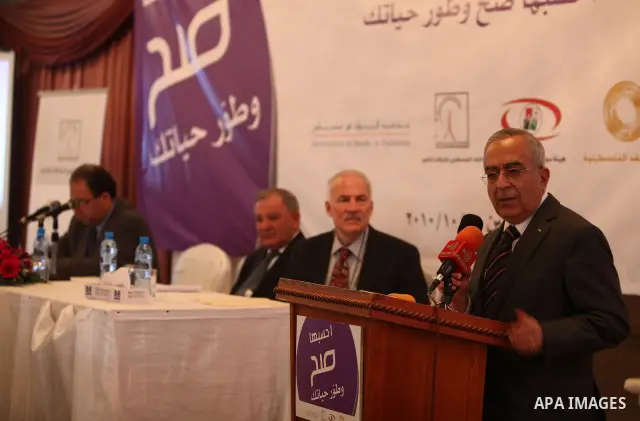 Palestinian Prime Minister Salam Fayad , during the launching of the financial awareness campaign , in the West Bank city of Ramallah on Oct. 25,2010 . Photo by Mustafa Abu Dayeh