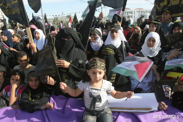 Palestinian Islamic Jihad supporters attend a rally to mark the 23rd anniversary of the establishment of the Islamic Jihad movement and the assassination of the founder of their movement Fathi Shiqaqi , in Gaza city on O...