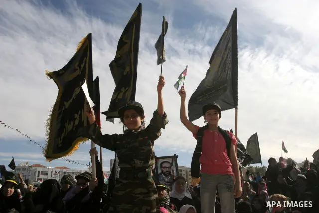 Palestinian Islamic Jihad supporters attend a rally to mark the 23rd anniversary of the establishment of the Islamic Jihad movement and the assassination of the founder of their movement Fathi Shiqaqi , in Gaza city on O...