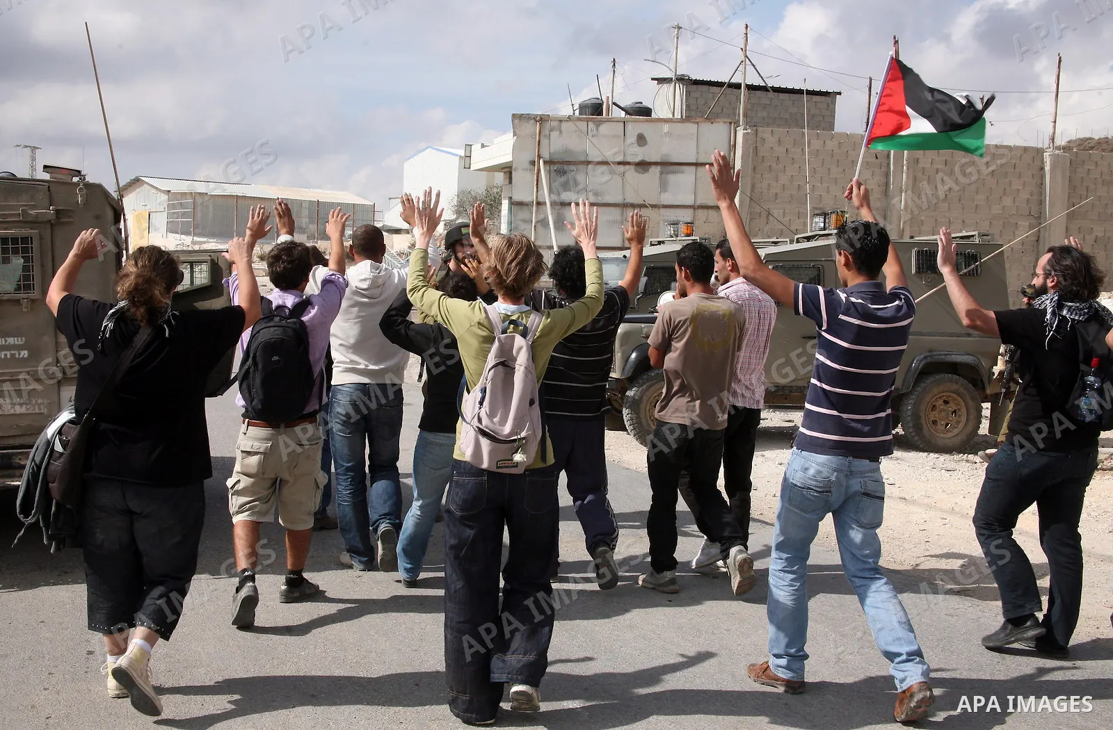 Israeli soldiers stand guard during a protest against the controversial Israeli barrier in the West Bank village of al-Masarah, near Bethlehem, October 29, 2010. Israel says the barrier is needed for security, but Palest...