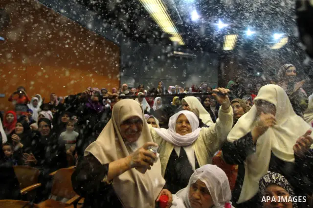 Palestinians celebrate a mass wedding held for the men wounded and made disabled during the 22 day offence by Israeli on the Gaza Strip in December 2008, in Gaza City on October 30, 2010. Photo by Ashraf Amra