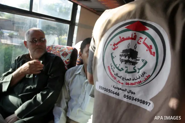 Palestinian pilgrims sit in buses as they wait to cross the Rafah border crossing into Egypt , in Gaza City on Nov. 3,2010 . Hundreds of Palestinian pilgrims crossed into Egypt on their way to Saudi Arabia to perform the...
