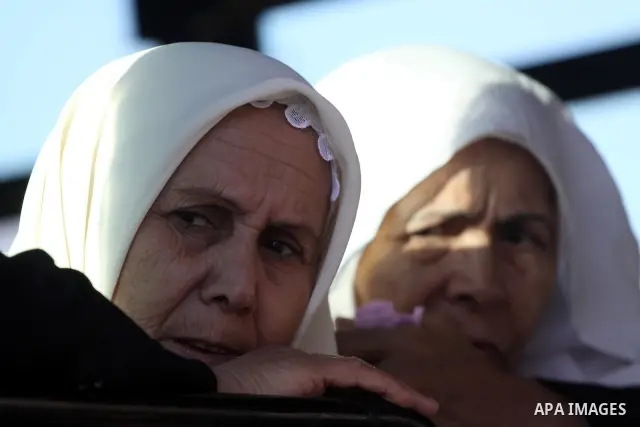 Palestinian pilgrims sit in buses as they wait to cross the Rafah border crossing into Egypt , in Gaza City on Nov. 3,2010 . Hundreds of Palestinian pilgrims crossed into Egypt on their way to Saudi Arabia to perform the...