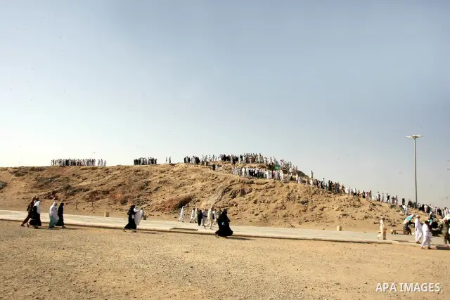 Muslim pilgrims stand on Ohod Mountain in the Saudi holy city of Medina on November 4, 2010. More than three million Muslims are expected to converge on the holy cities of Mecca and Medina in western Saudi Arabia for the...