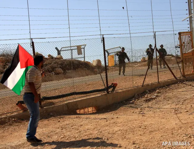 Israeli soldiers take position during a demonstration by Palestinians against Israel's separation barrier in the West Bank village of Bilin near Ramallah, Friday,Nov. 4, 2010. Photo by Wagdi Eshtayah