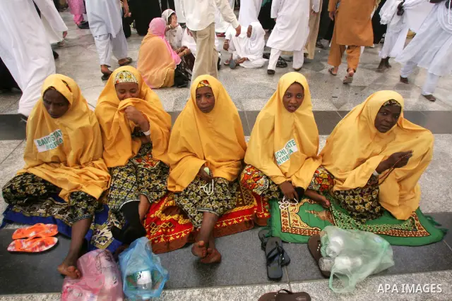 Muslim pilgrims attend Friday prayers outside the Prophet Mohammed Mosque in the Saudi holy city of Medina on November 5, 2010. More than three million Muslims are expected to converge on the holy cities of Mecca and Med...