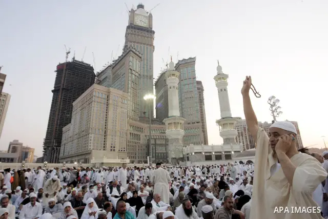 Muslim pilgrims sit outside the Grand Mosque during the annual Hajj in Mecca, Saudi Arabia, Nov 7, 2010. Some 2.5 million Muslims from more than 160 countries converge annually on the Islamic cities of Mecca and Medina i...
