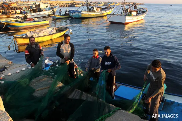 Palestinian fishermen work inside the port of Gaza City on Nov. 9, 2010. Fishermen, suffer from the tightening of the Israeli siege imposed on Palestinian fishermen a forbidden fishermen by Israel to enter the sea for mo...
