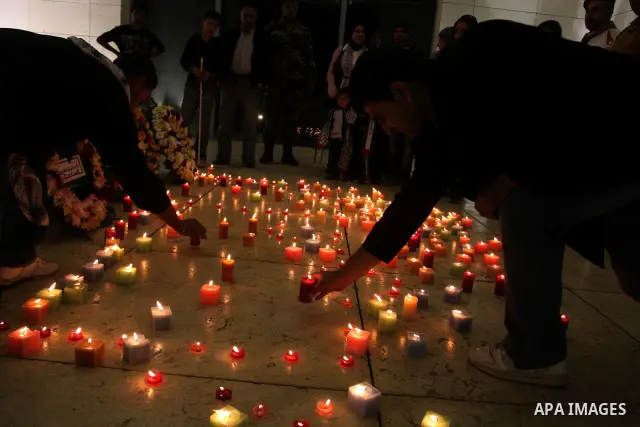 Palestinians light candles at the grave of the late Palestinian leader Yasser Arafat in the West Bank town of Ramallah, on 10 November 2010 on the sixth anniversary of Arafat death. Photo by Issam Rimawi