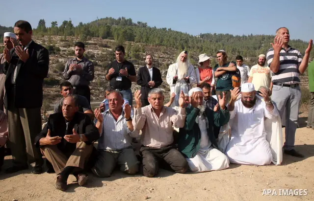 Christians, Jews and Muslims join a prayer calling for rain on November 11, 2010 in the West Bank village of Walajeh near Bethlehem. The amounts of rainfall in Israel and Palestinian territories have been lower than the...