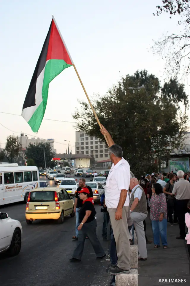 Left-wing Israeli, foreign and Palestinian protestors attend a weekly demonstration in the mainly Arab neighbourhood of Sheikh Jarrah on November 12, 2010 calling for an end of occupation of Palestinian house by Israeli...