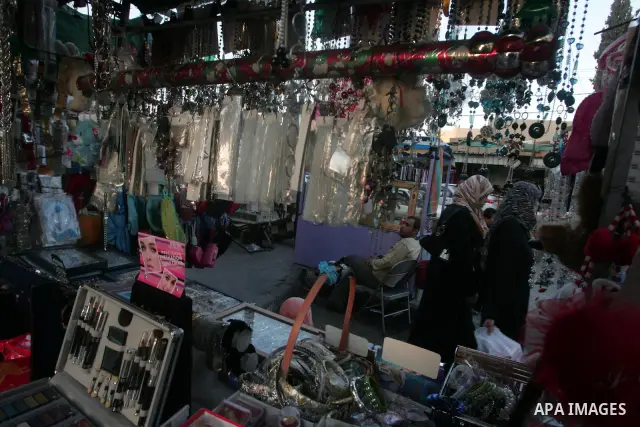 Palestinians shop at a market in the southern Gaza Strip town of Rafah on 14 November 2010, in preparation for the Muslim holiday of Eid al-Adha or the Feast of Sacrifice, which marks the end of the annual pilgrimage. Ph...