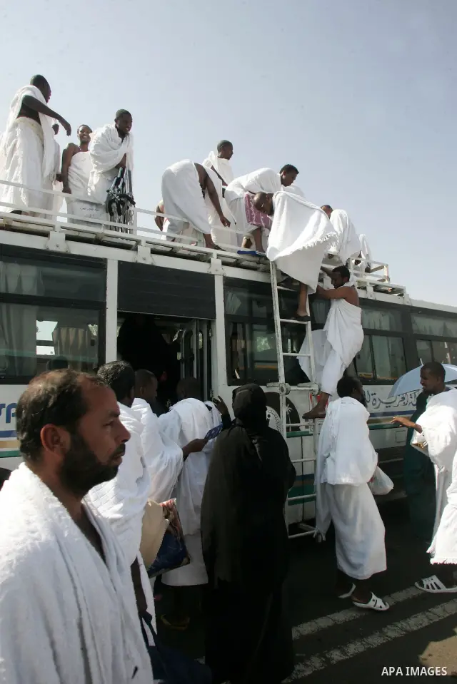 Muslim pilgrims stand at Mount Arafat, southeast of the Saudi holy city of Mecca, on November 15, 2010. Pilgrims flooded into the Arafat plain from Mecca and Mina before dawn for a key ritual around the site where prophe...