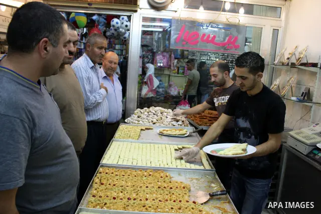 Palestinians shop at a market in the old city of Jerusalem on November 15, 2010, ahead of the Muslim holiday of Eid al-Adha or Feast of the Sacrifice, which marks the end of the annual hajj or pilgrimage to Mecca and is...