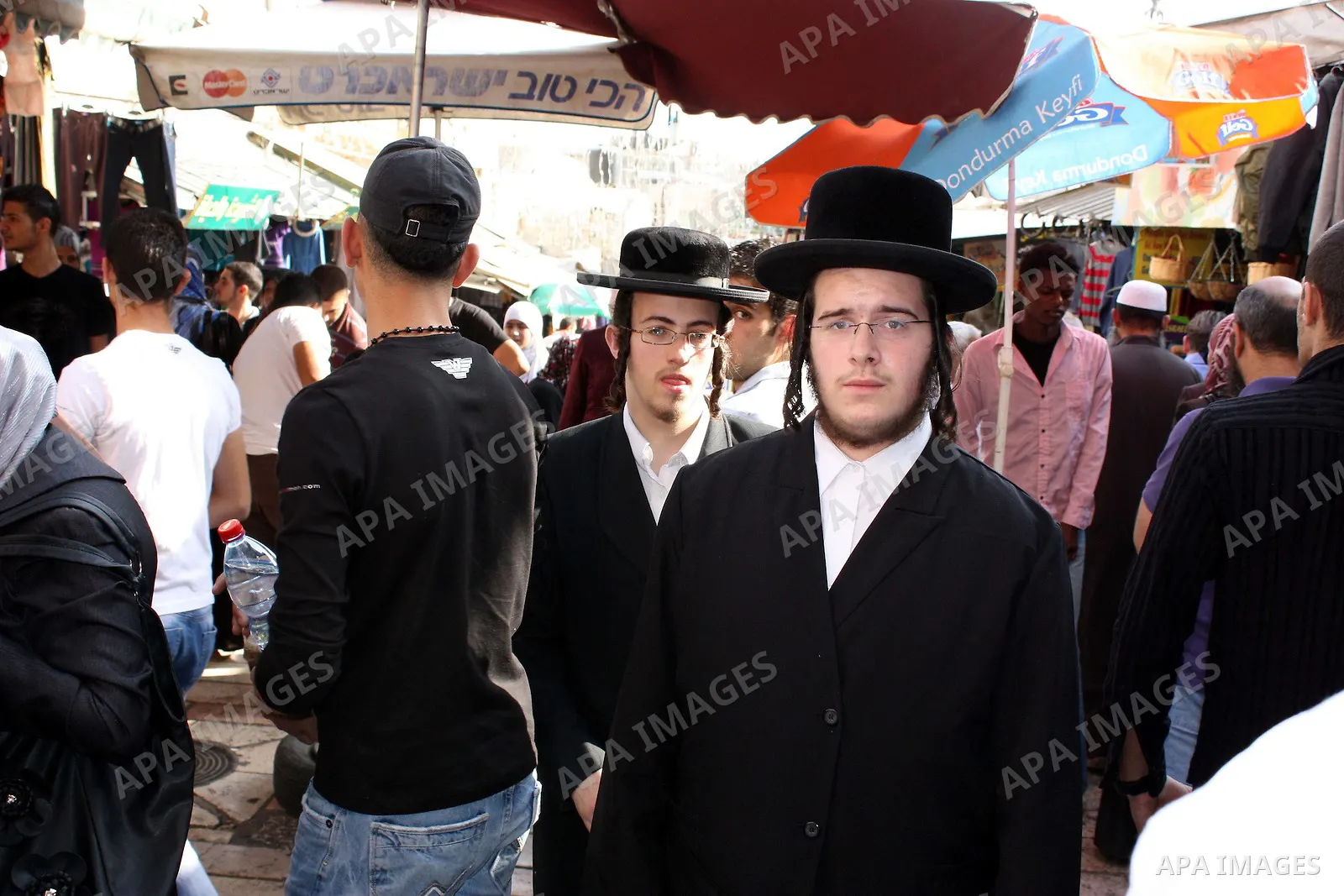 Palestinians shop at a market in the old city of Jerusalem on November 15, 2010, ahead of the Muslim holiday of Eid al-Adha or Feast of the Sacrifice, which marks the end of the annual hajj or pilgrimage to Mecca and is...