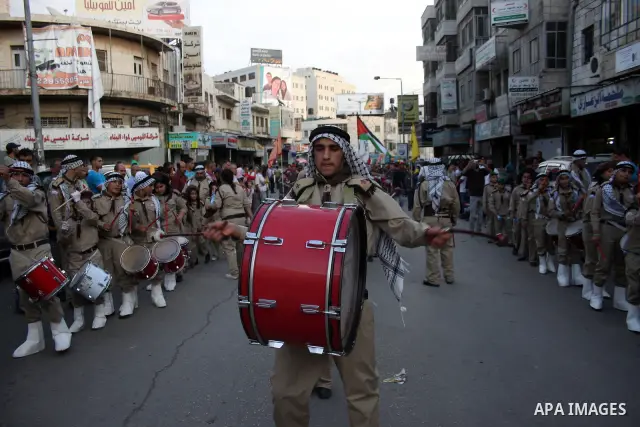 Palestinian youths banging drums in the march of Scouting, in West Bank city of Ramallah on November 15, 2010, ahead of the Muslim holiday of Eid al-Adha or Feast of the Sacrifice, which marks the end of the annual hajj...