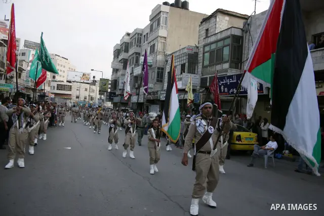 Palestinian youths banging drums in the march of Scouting, in West Bank city of Ramallah on November 15, 2010, ahead of the Muslim holiday of Eid al-Adha or Feast of the Sacrifice, which marks the end of the annual hajj...